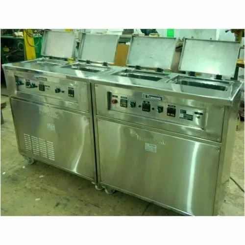 Multistage ultrasonic cleaning system
